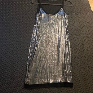 Silver and black sequins dress.
